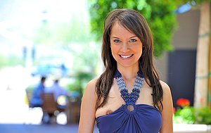 Dark-haired babe with blue eyes shows her young body in public