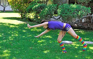 Blue-eyed babe doing splits and cartwheels while naked outdoors