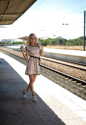 Train station tease from a tiny blond-haired amateur with sexy legs