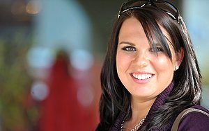 Big-breasted brunette pulls down her panties to reveal that MEATY ass