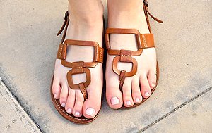 Gorgeous girl in a white dress exposing her feet and pussy in public