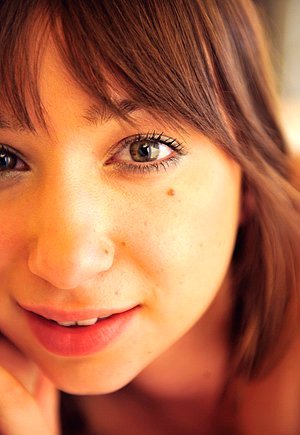 Adorable brunette with a shapely booty fingering and massaging her pussy