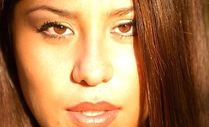 Brunette with a charming smile shows her boobies and then some