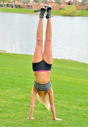 Fitness freak blonde doing handstands and posing totally naked