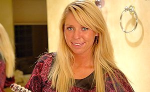 Hot blondie keeps her legs up while banging herself with a dildo