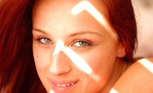 Redheaded girl and her blonde GF are exposing each other\'s wet slits